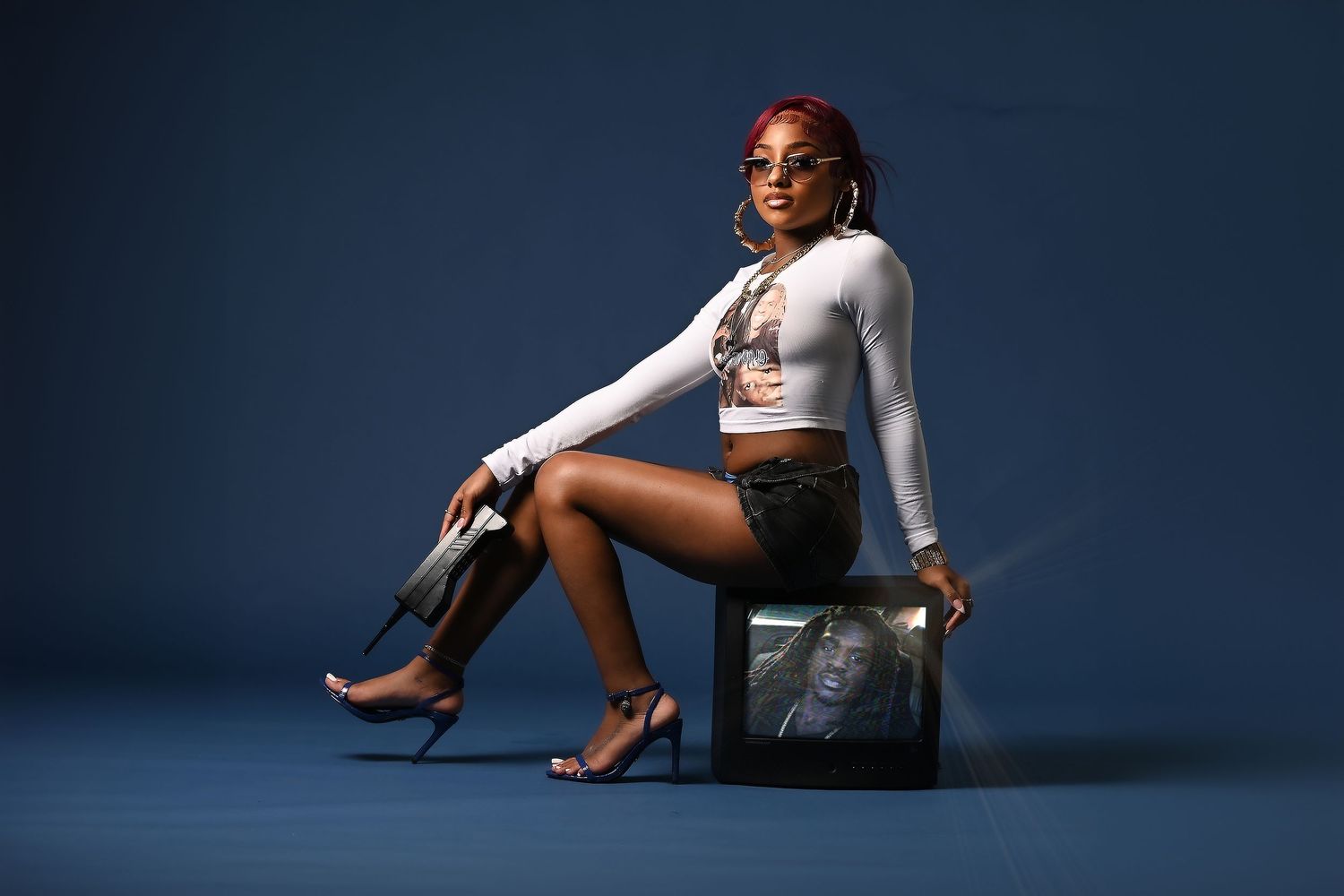 Professional photo series showing dramatic poses against a dark blue studio backdrop. In Tampa Florida.
