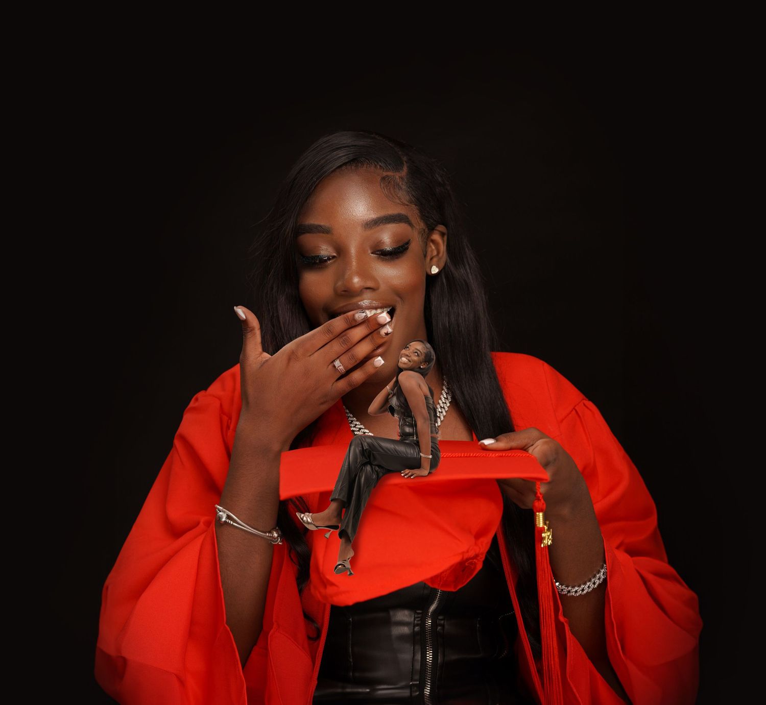 Young woman in red jacket blowing a kiss against dark background, wearing silver jewelry.