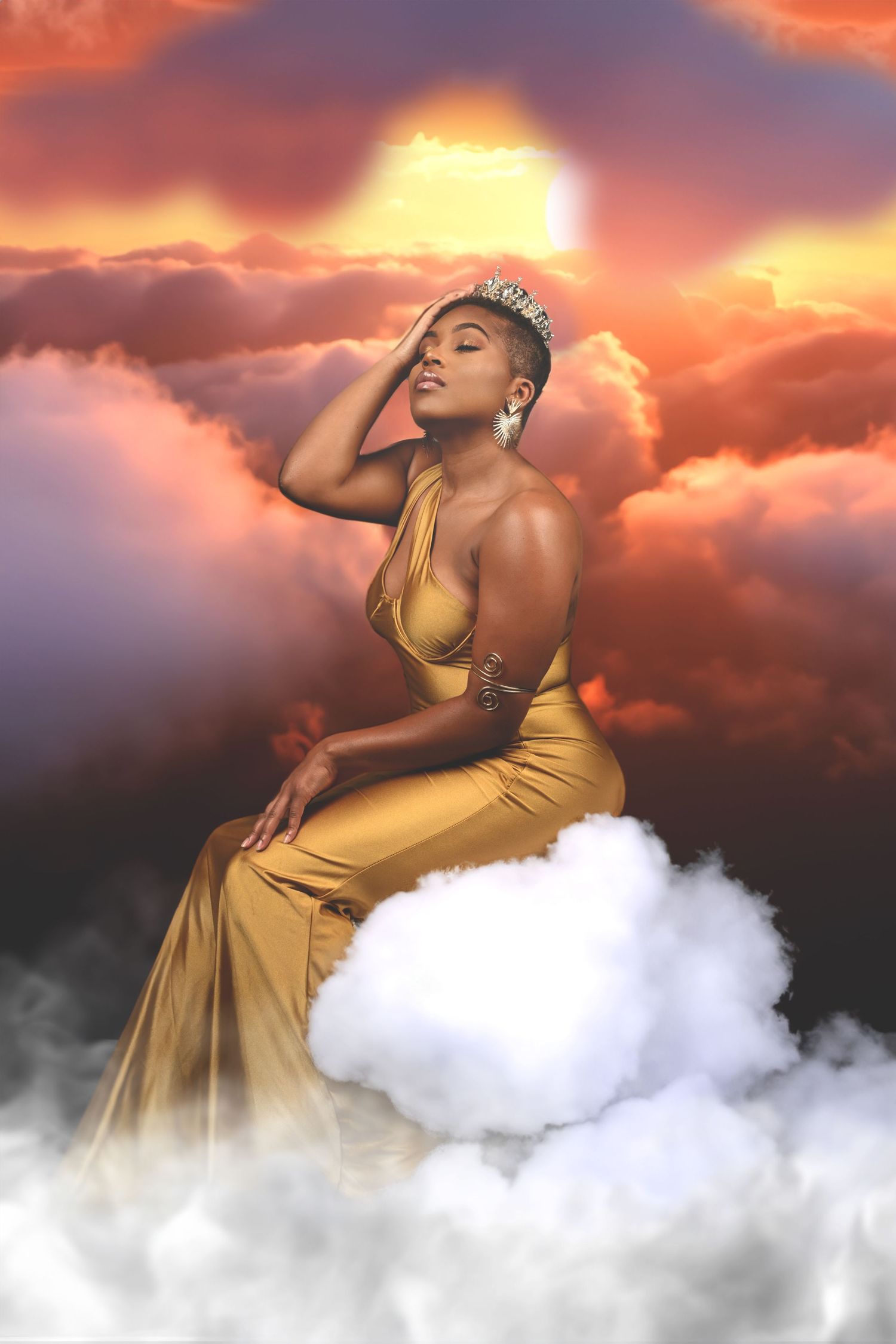 Ethereal fashion photographs featuring golden dress against sunset clouds. In Tampa Florida.