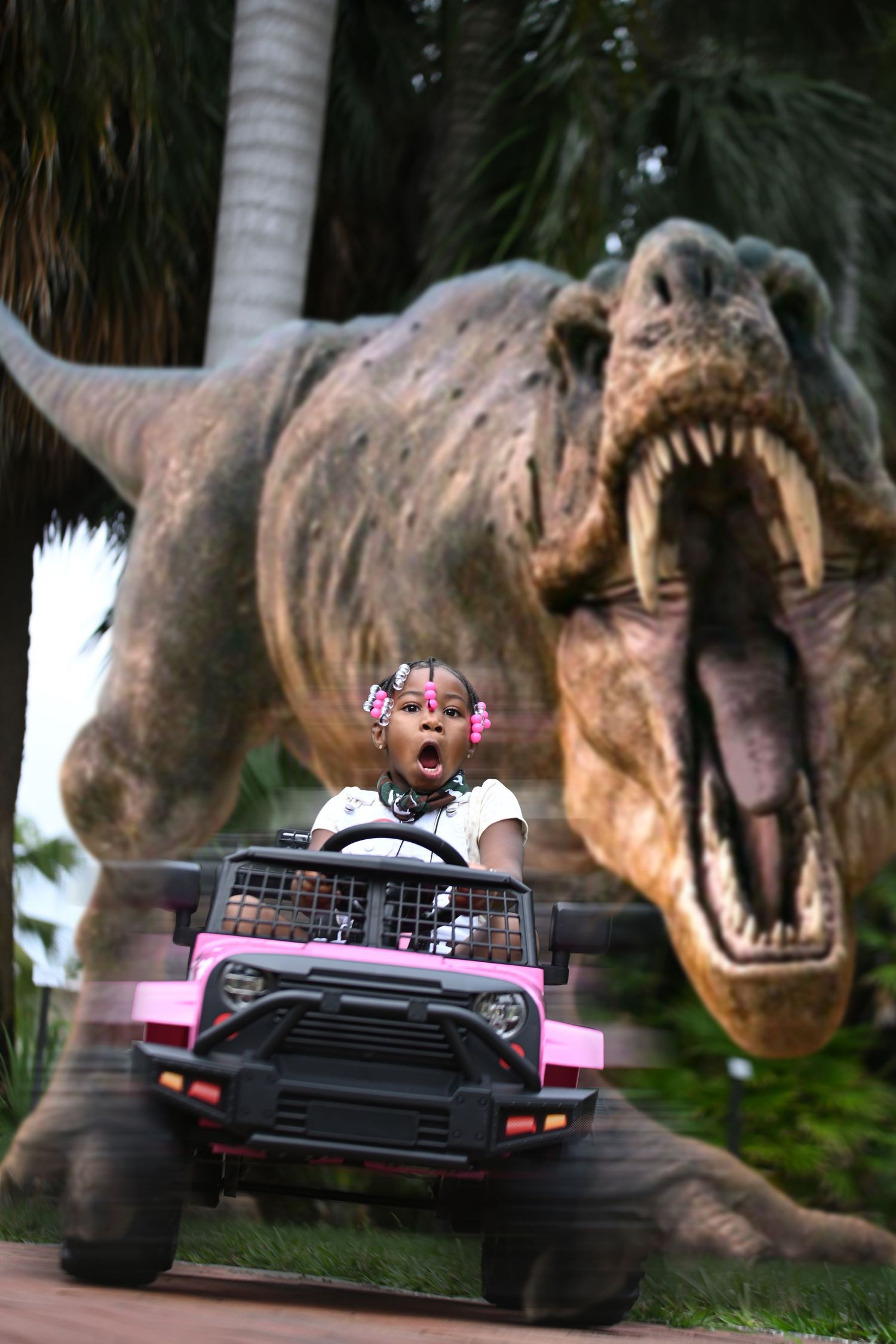 Pink toy car being chased by a T-Rex in a dramatic Jurassic Park style scene. In Tampa Florida.