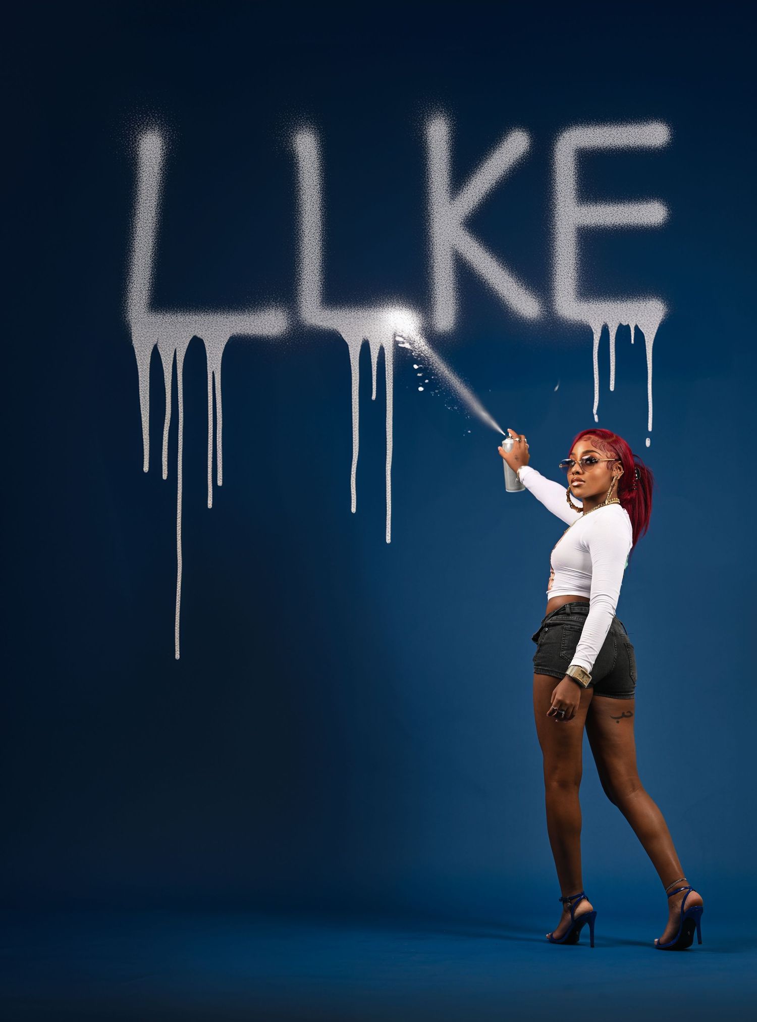 Urban style photo series against blue wall with dripping paint effect. In Tampa Florida.