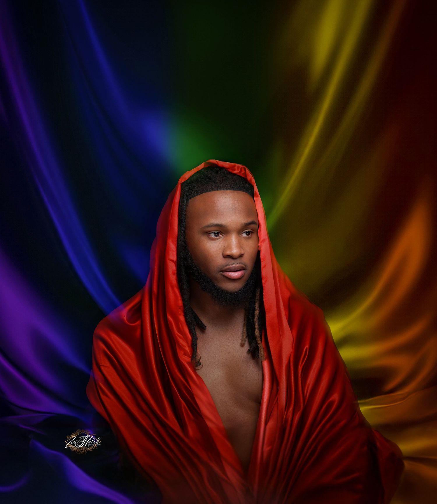 Artistic portrait with red draped fabric against colorful gradient background in Saint Petersburg Florida.