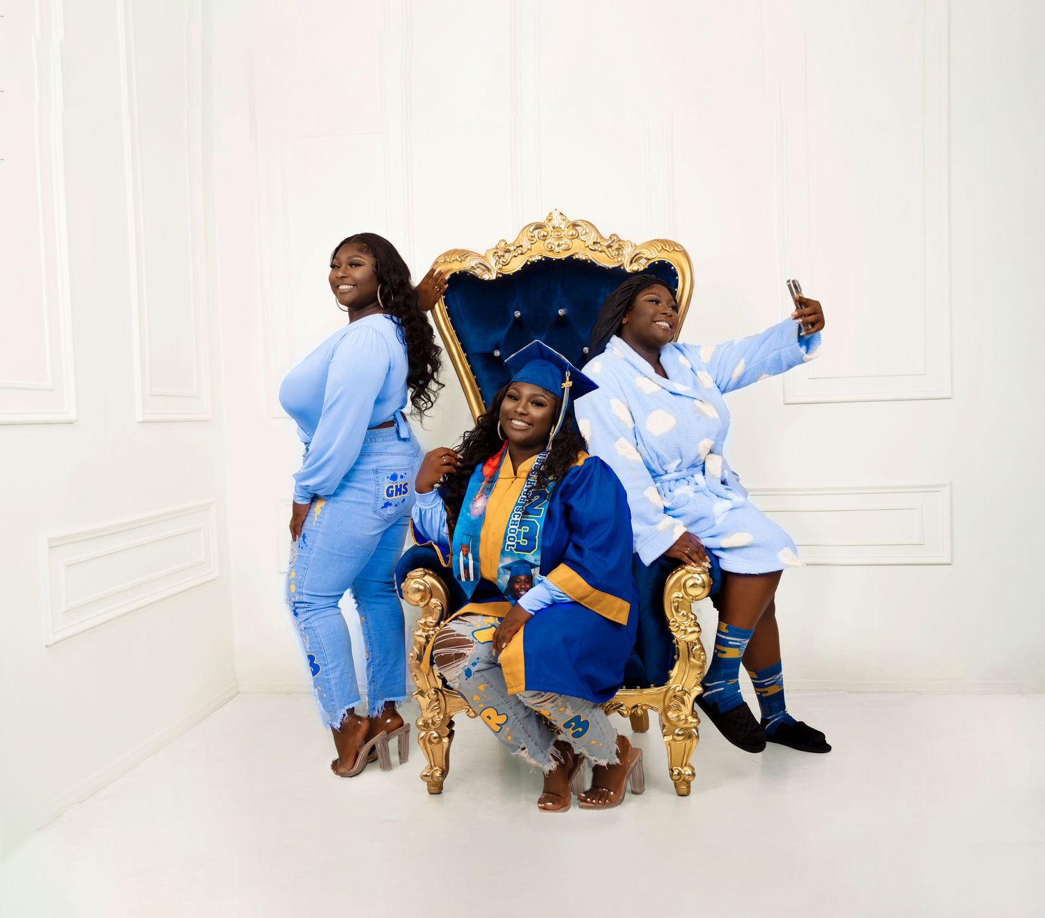 Alter Ego photoshoot on an ornate gold chair against a white studio backdrop.