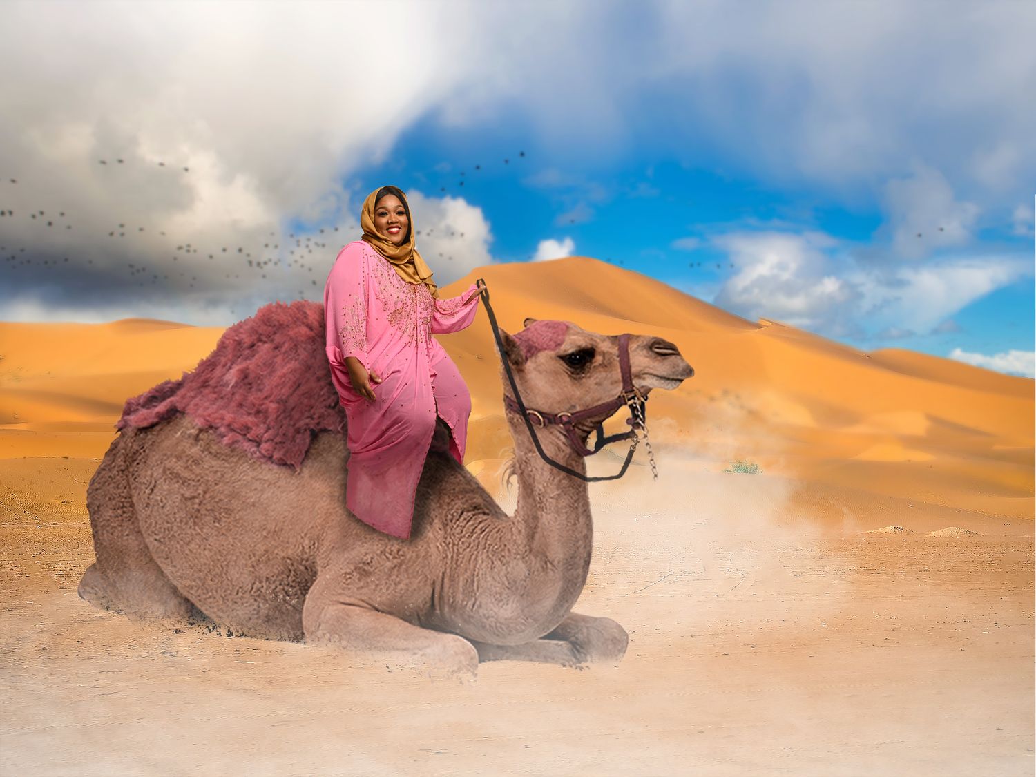Desert photoshoot featuring model riding camel across sand dunes at sunset. In Tampa Florida.