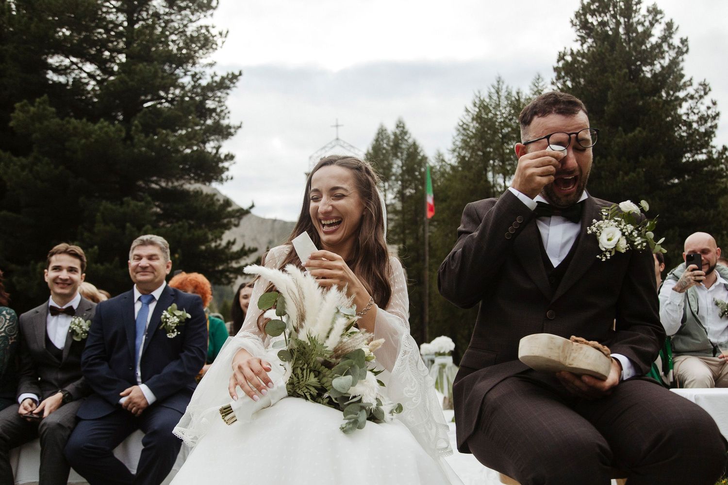 Wedding celebration sequence showing joyful moments and candid interactions between couples and guests outdoors.