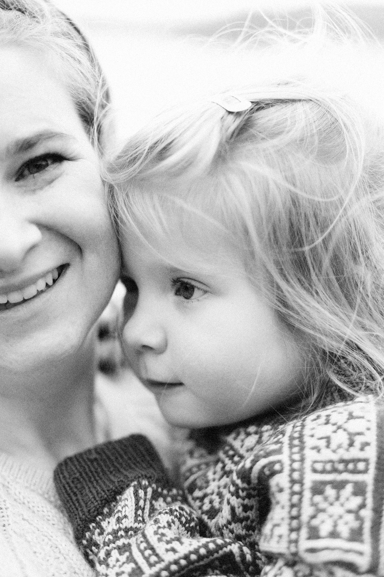 An intimate black and white close-up portrait showing affection and connection.