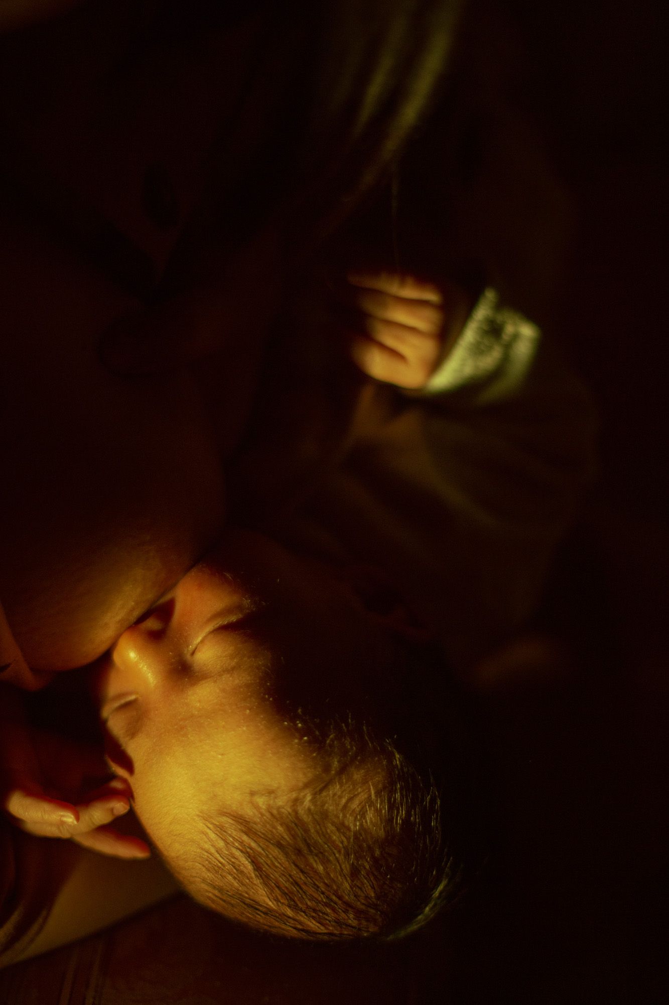 A series of moody, dimly lit portraits in warm amber lighting showing different angles of someone resting.