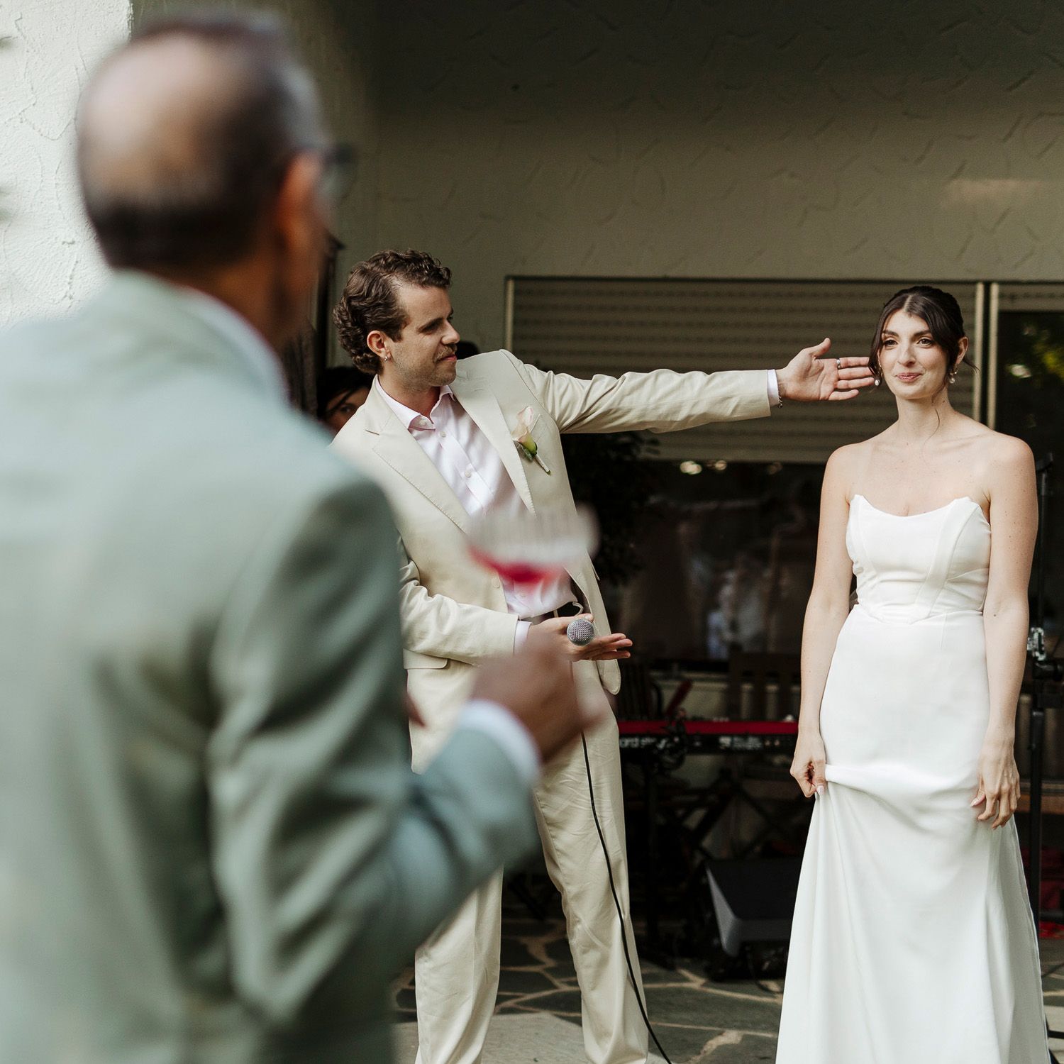 A series of candid wedding moments showing a couple and guests interacting during an outdoor celebration.