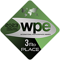 A green diamond-shaped WPE International Photography Awards 3rd Place badge.