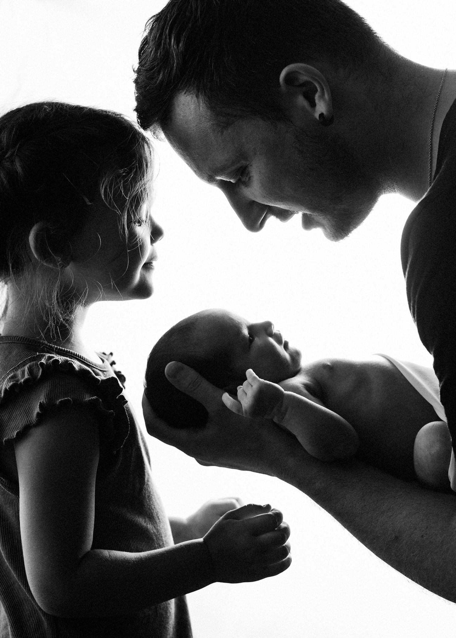 A series of romantic silhouettes show couples in intimate poses against bright backlighting creating dramatic contrast.