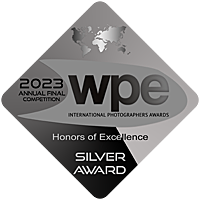 A silver WPE International Photography Awards silver award badge.