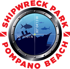 Shipwreck Park Pompano Beach logo featuring a porthole with sharks, a shipwreck, and GPS coordinates 26°14.01N 80°04.13W.