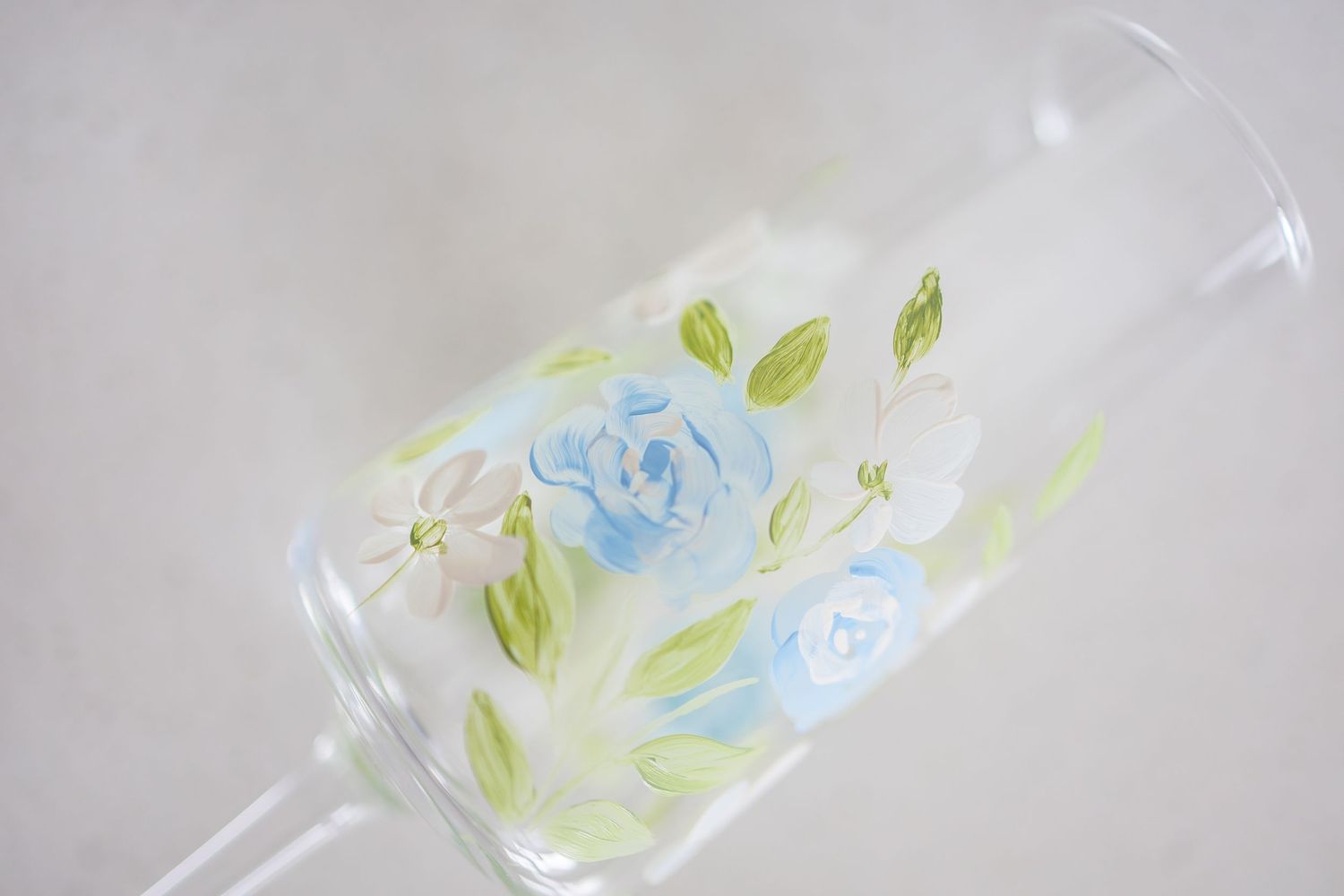 Clear plastic bags filled with blue and green confetti lay scattered on a white surface.