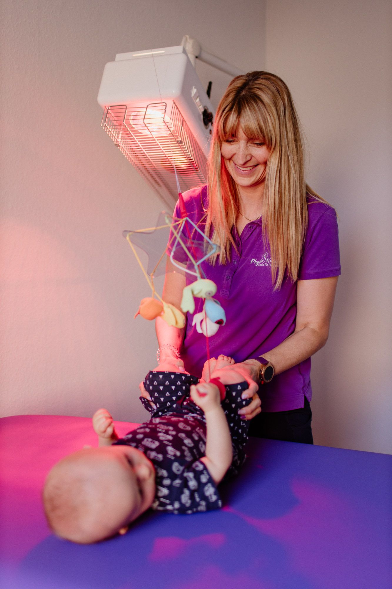 Therapy session with sensory toys and red infrared light.