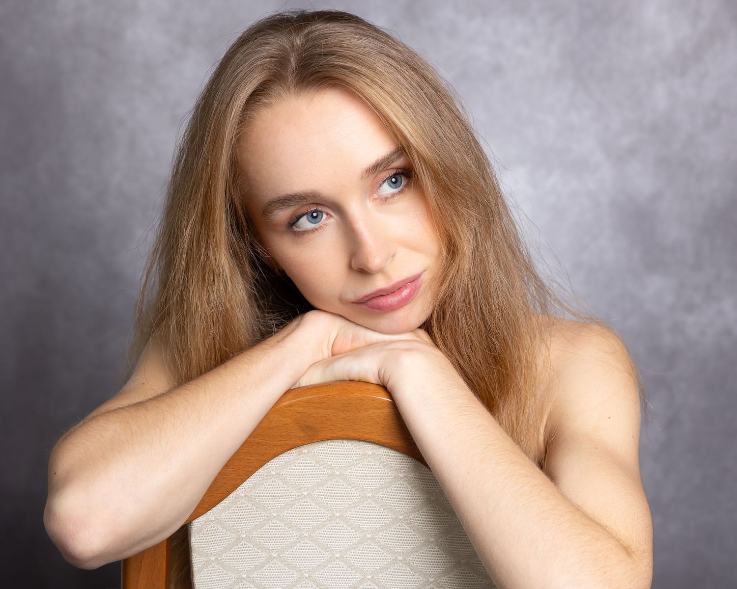 A portrait series showing different poses and expressions against a gray studio backdrop.