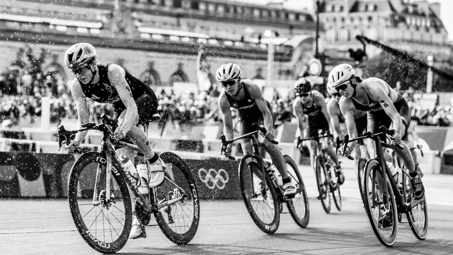 Professional cyclists compete in an Olympic road race event.