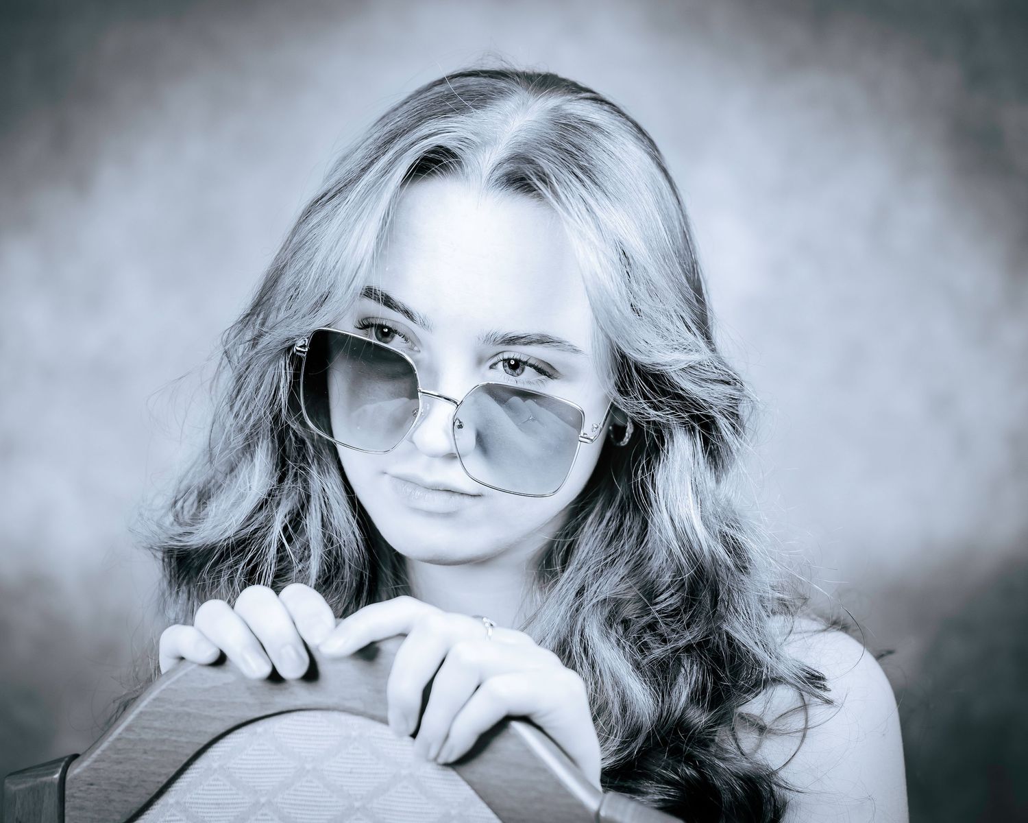 A series of seven black and white artistic portraits showing different dramatic poses and expressions.