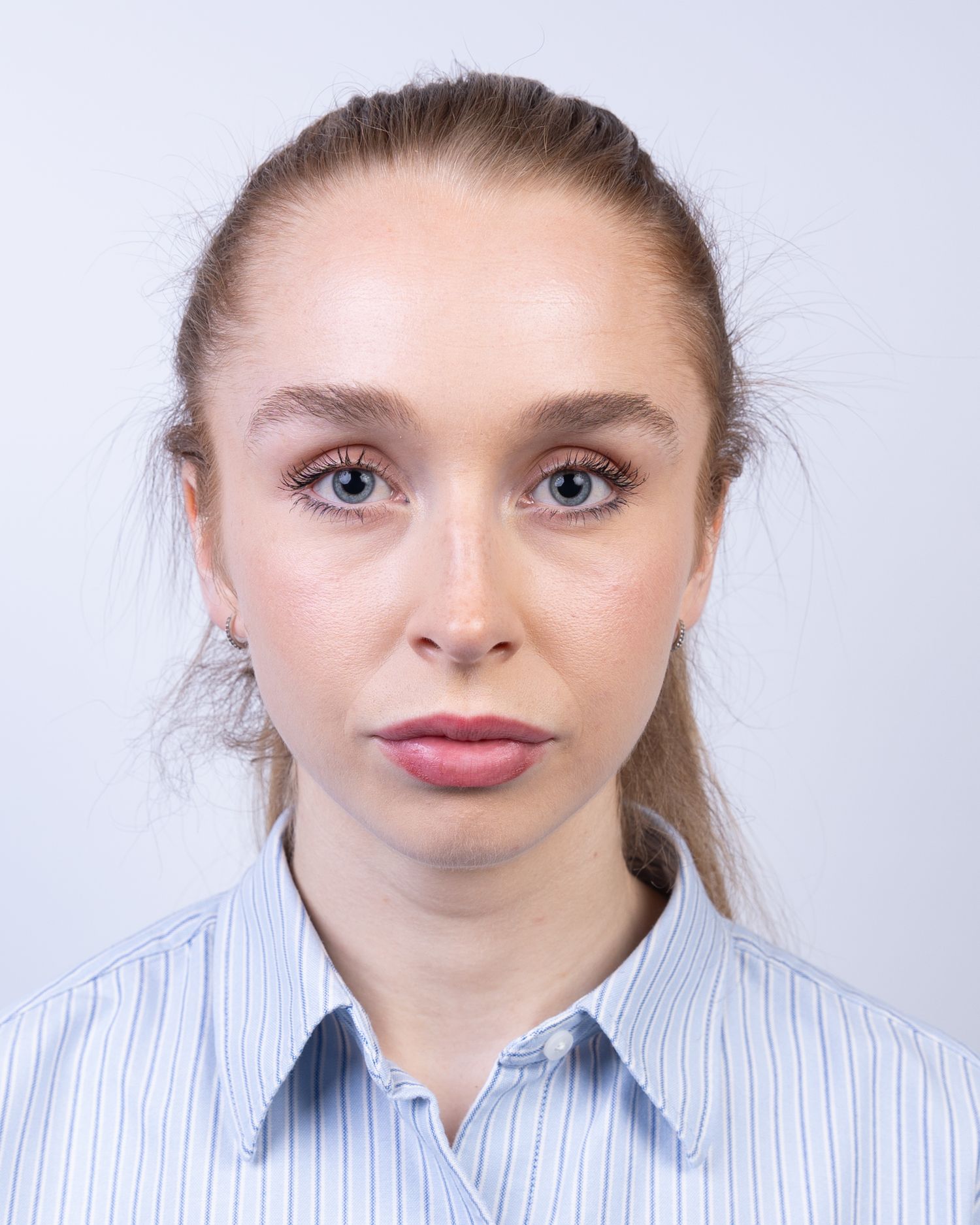 A series of headshots showing different facial expressions against a white background.