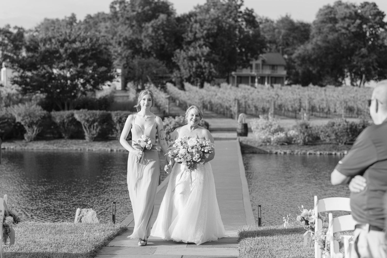 Bride and daughter walking down aisle