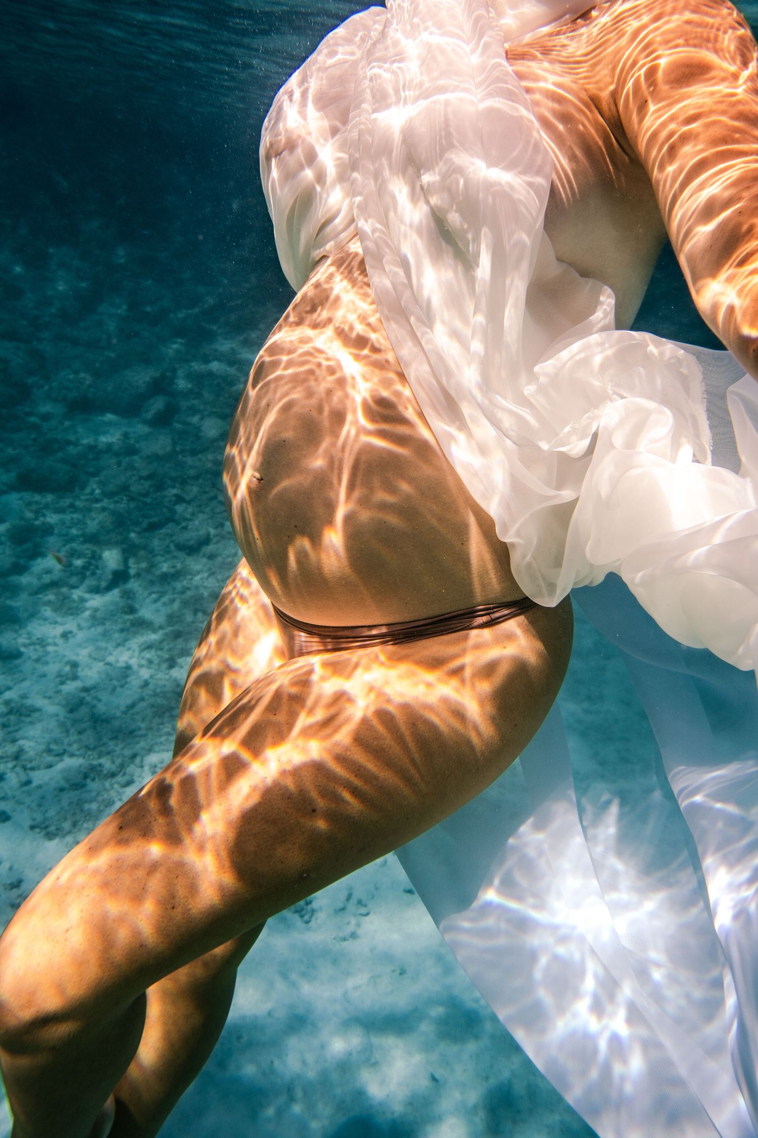 Underwater pregnancy shoot on Curacao / Onderwater zwangerschaps shoot op Curaçao.