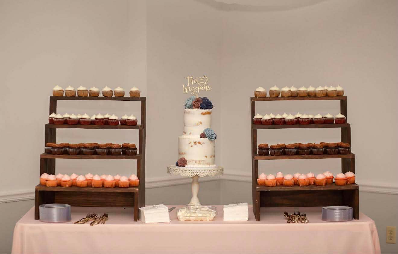 A panoramic view of elegant wooden chairs arranged at tables with white tablecloths in a formal dining setting.