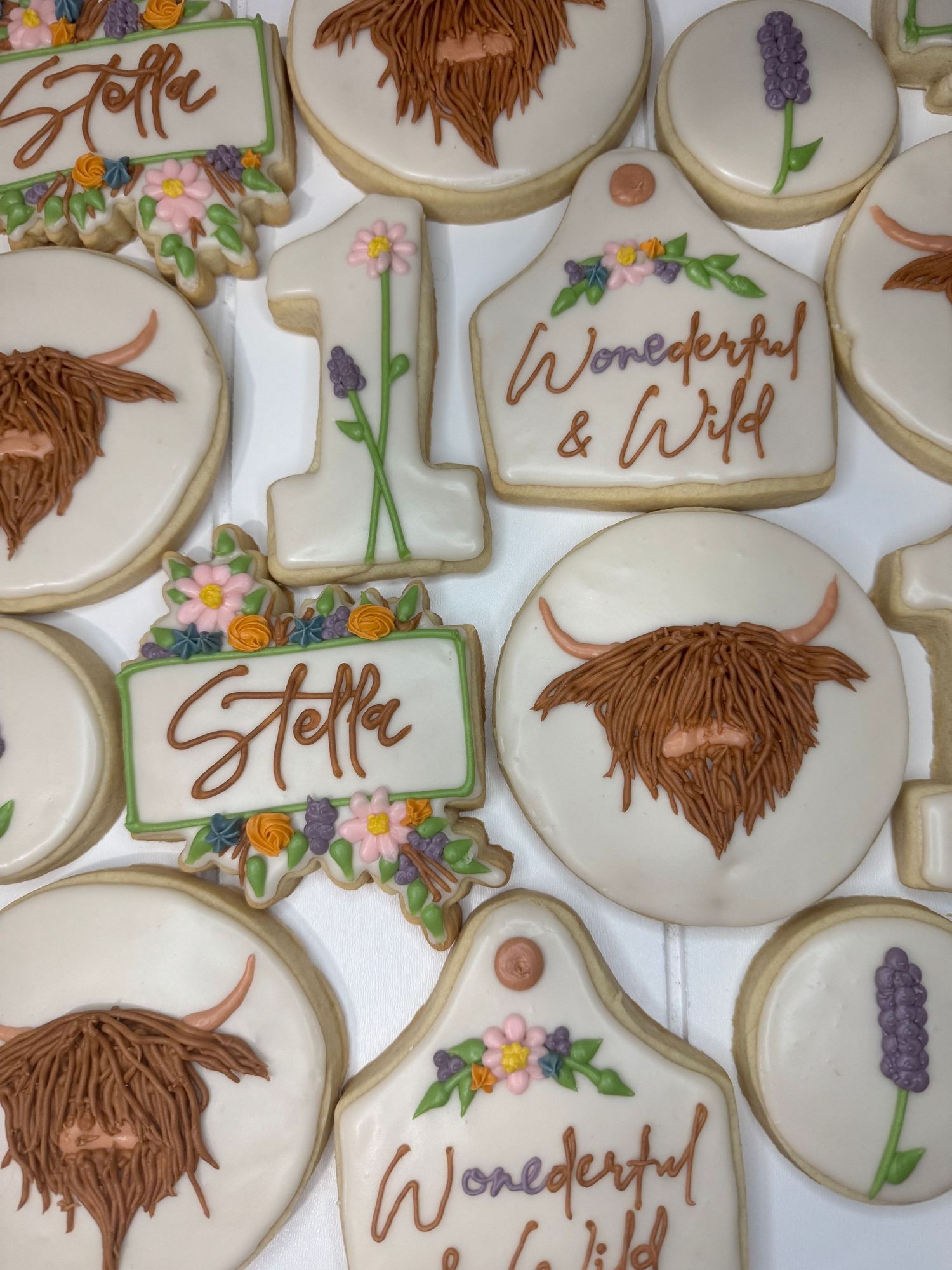 Floral decorated cookies featuring beards and lavender sprigs with delicate icing details.