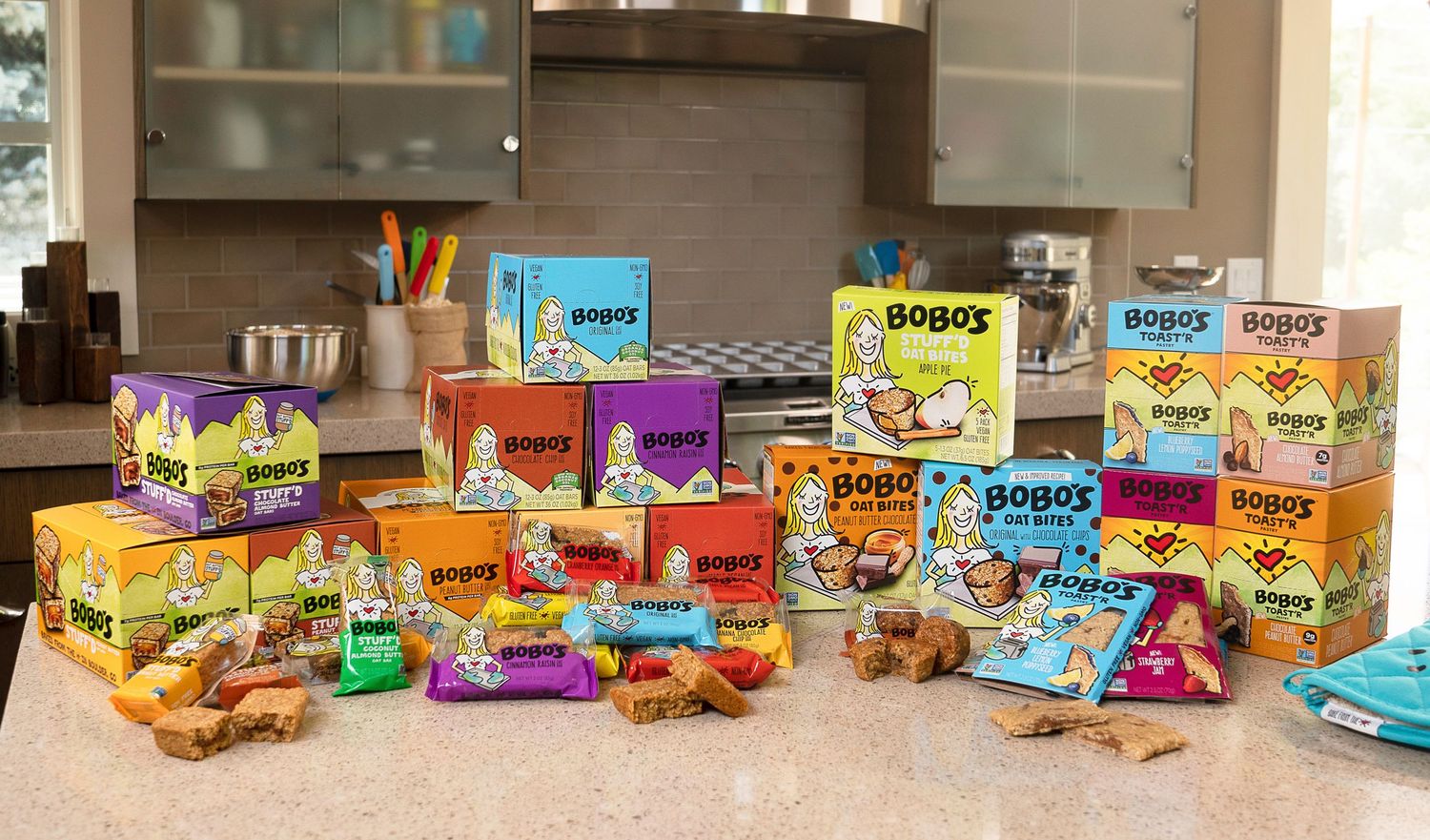 Various colorful snack packages and food products arranged in a retail display.