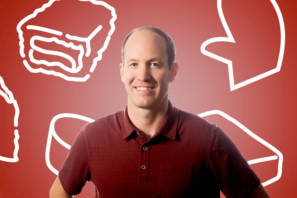 Professional portrait against red background with cartoon sandwich illustrations.