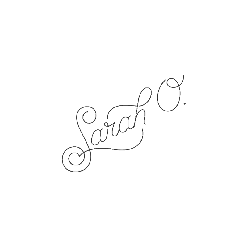 Elegant cursive script spelling Sarah Co in a decorative handwritten style.