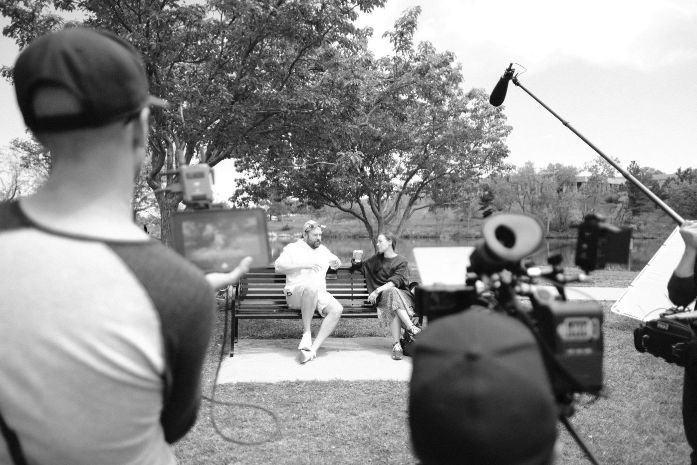 A series of black and white archery photos showing people practicing with bows and arrows outdoors.