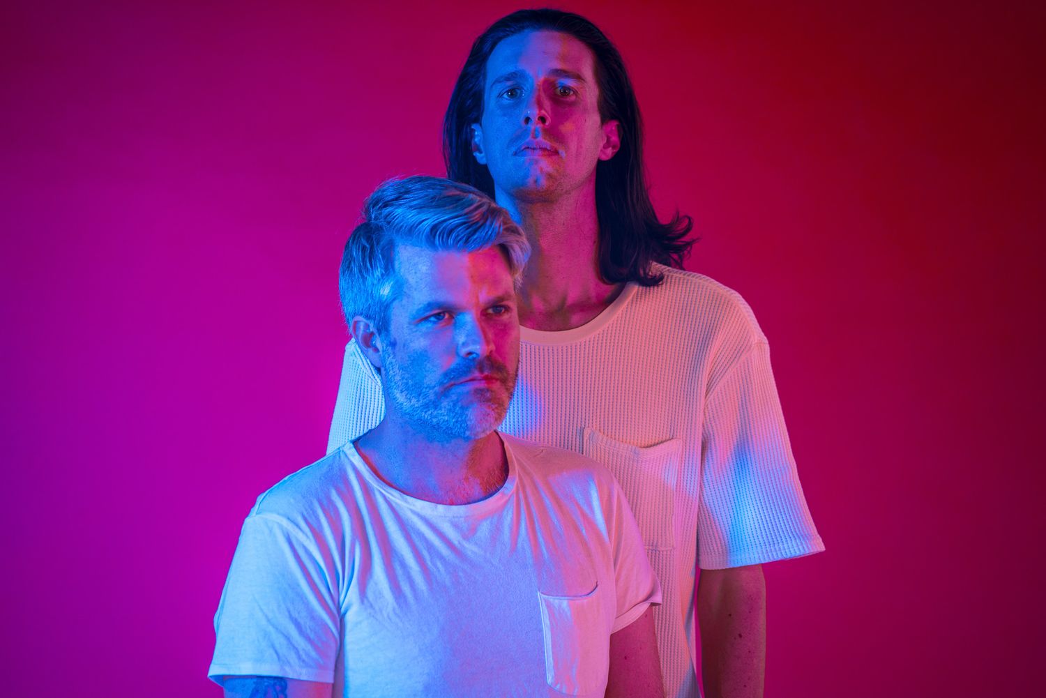 Artistic portrait series with dramatic red and blue lighting effects.