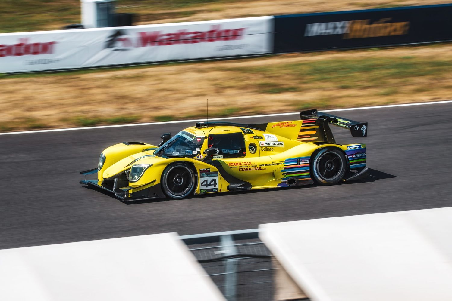 ARC Bratislava yellow race car speeding on the track during the Slovak Cup GT Series at Slovakia Ring in Orechová Potôň, Slovakia.