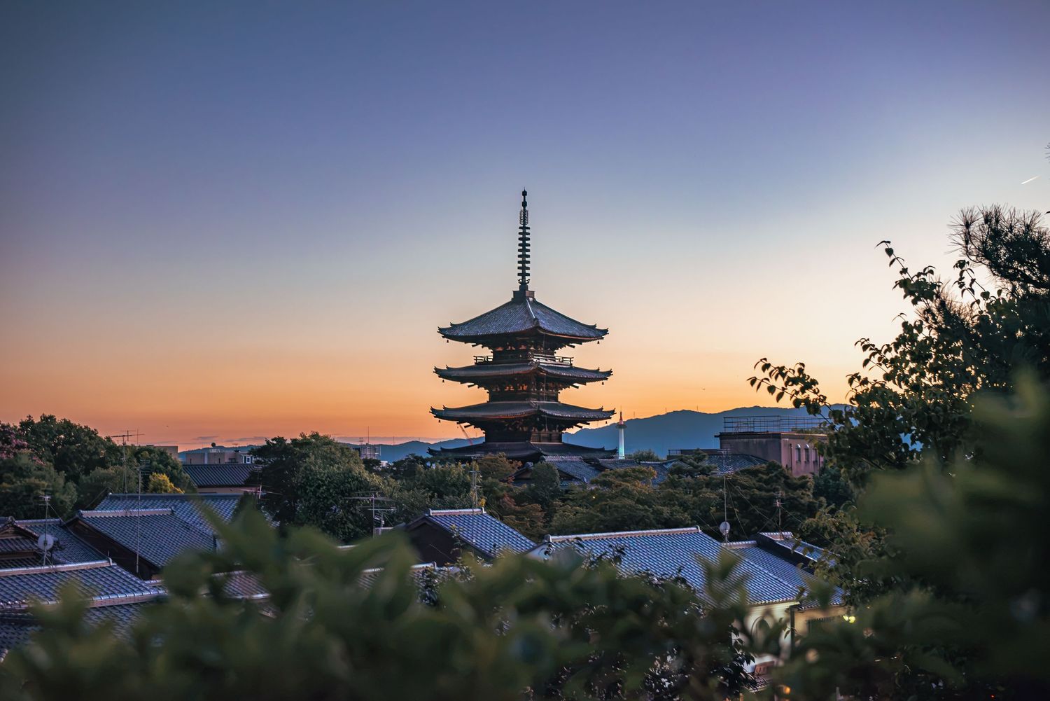 Yasaka Pagoda (Hōkan-ji Temple) in the Higashiyama district of Kyoto, Japan, captured at dusk against a twilight sky.