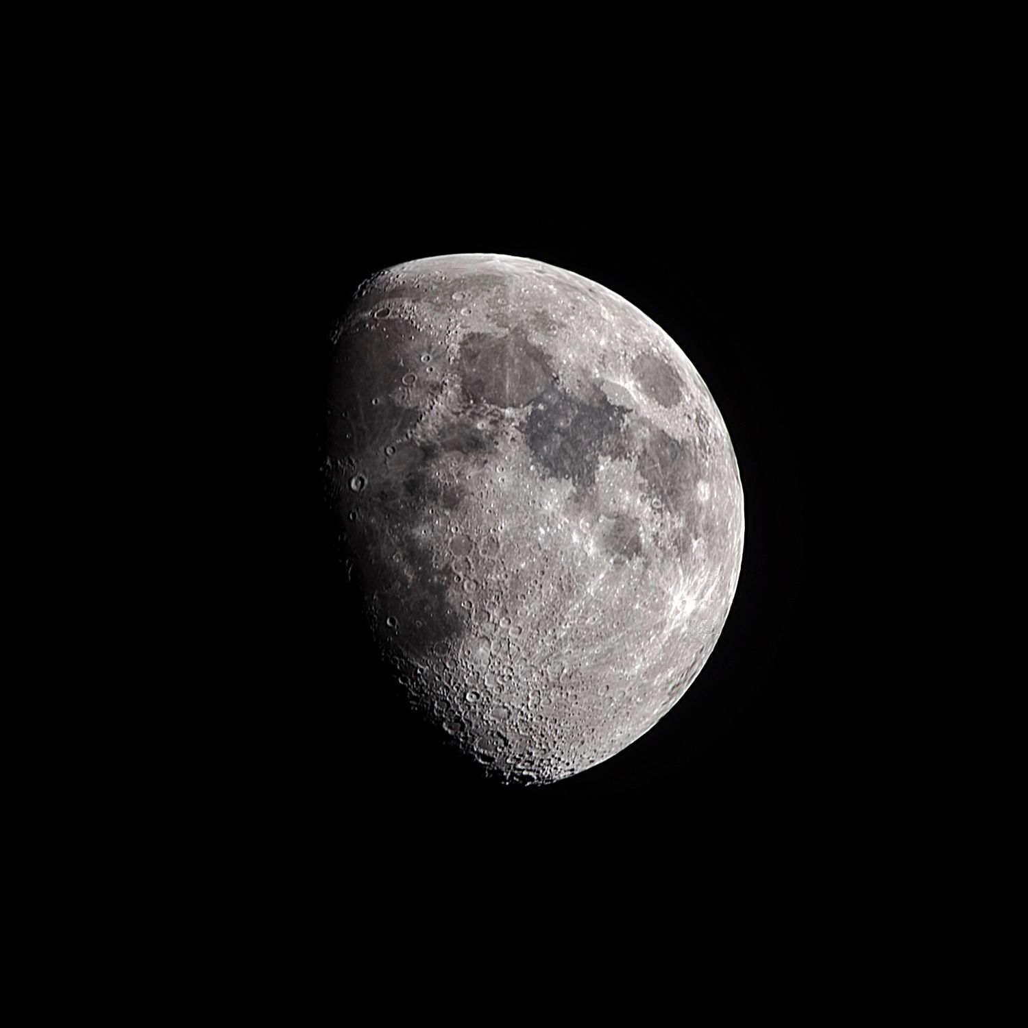Detailed lunar photography capturing a waxing gibbous Moon phase with sharp craters and surface textures against a black background.