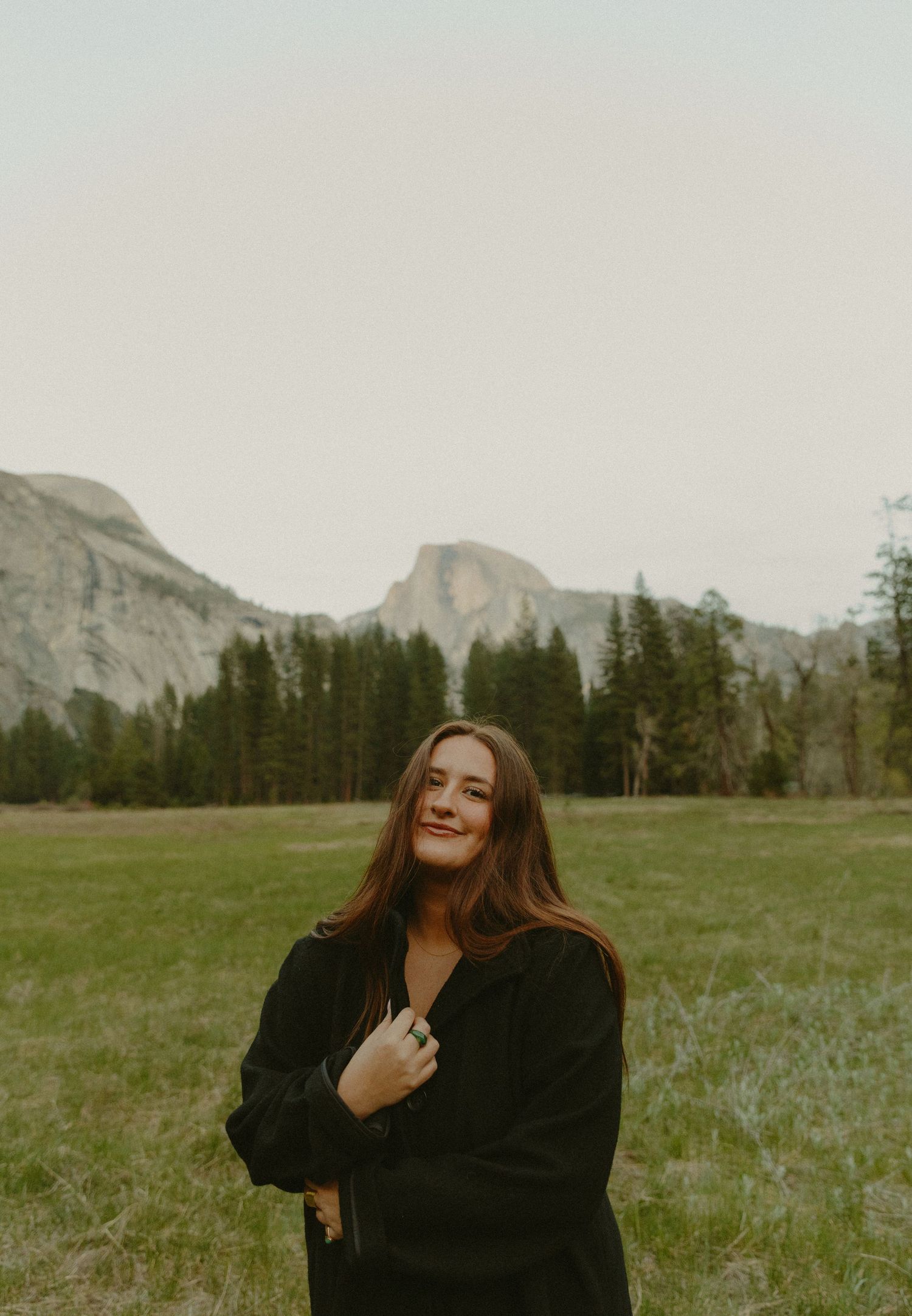 Stella Villada Portrait of Oregon wedding and elopement photographer in Yosemite National Park with Half Dome visible in the background.