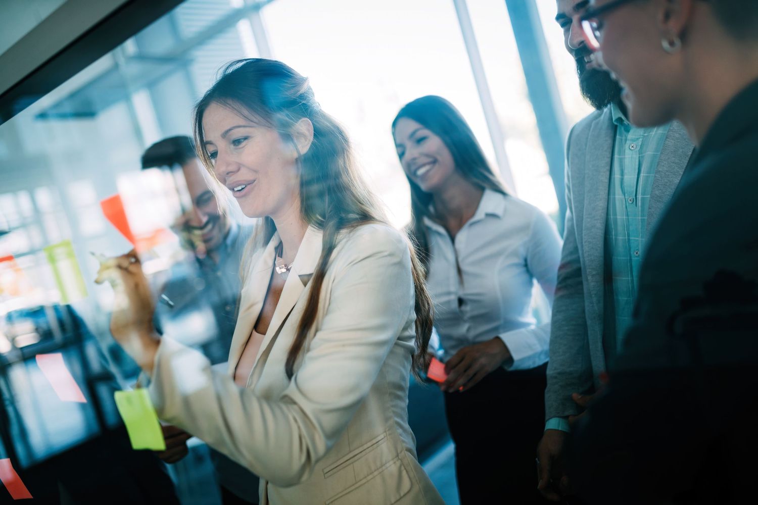 Corporate team members socializing during an office celebration.