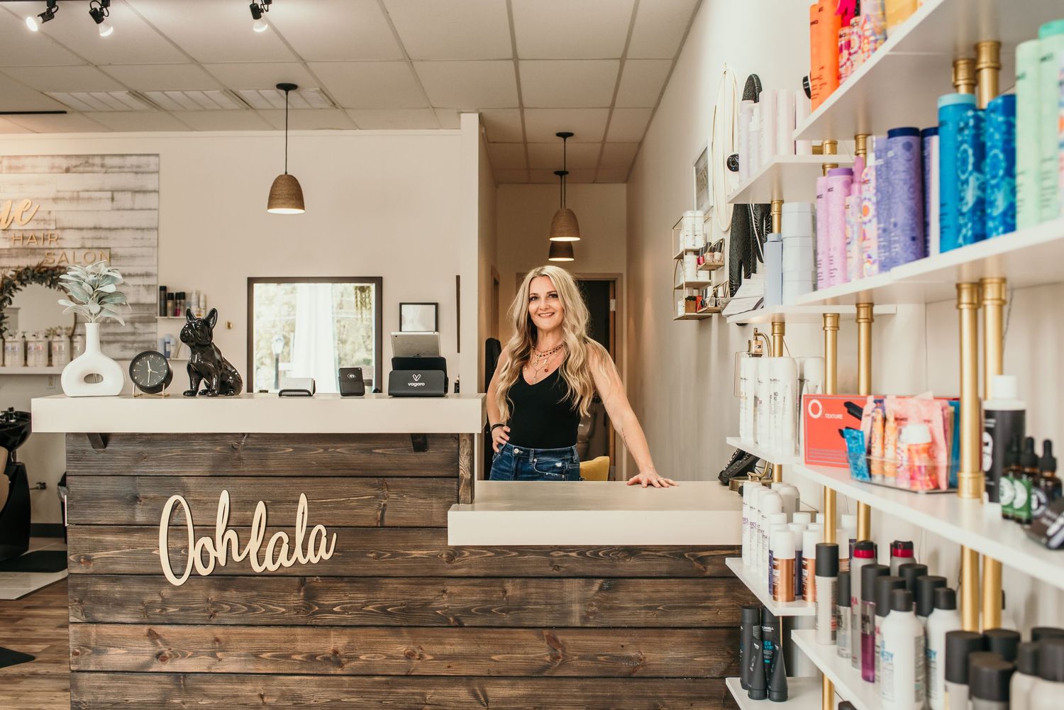 Modern boutique interior with colorful wall displays and rustic wood accents.