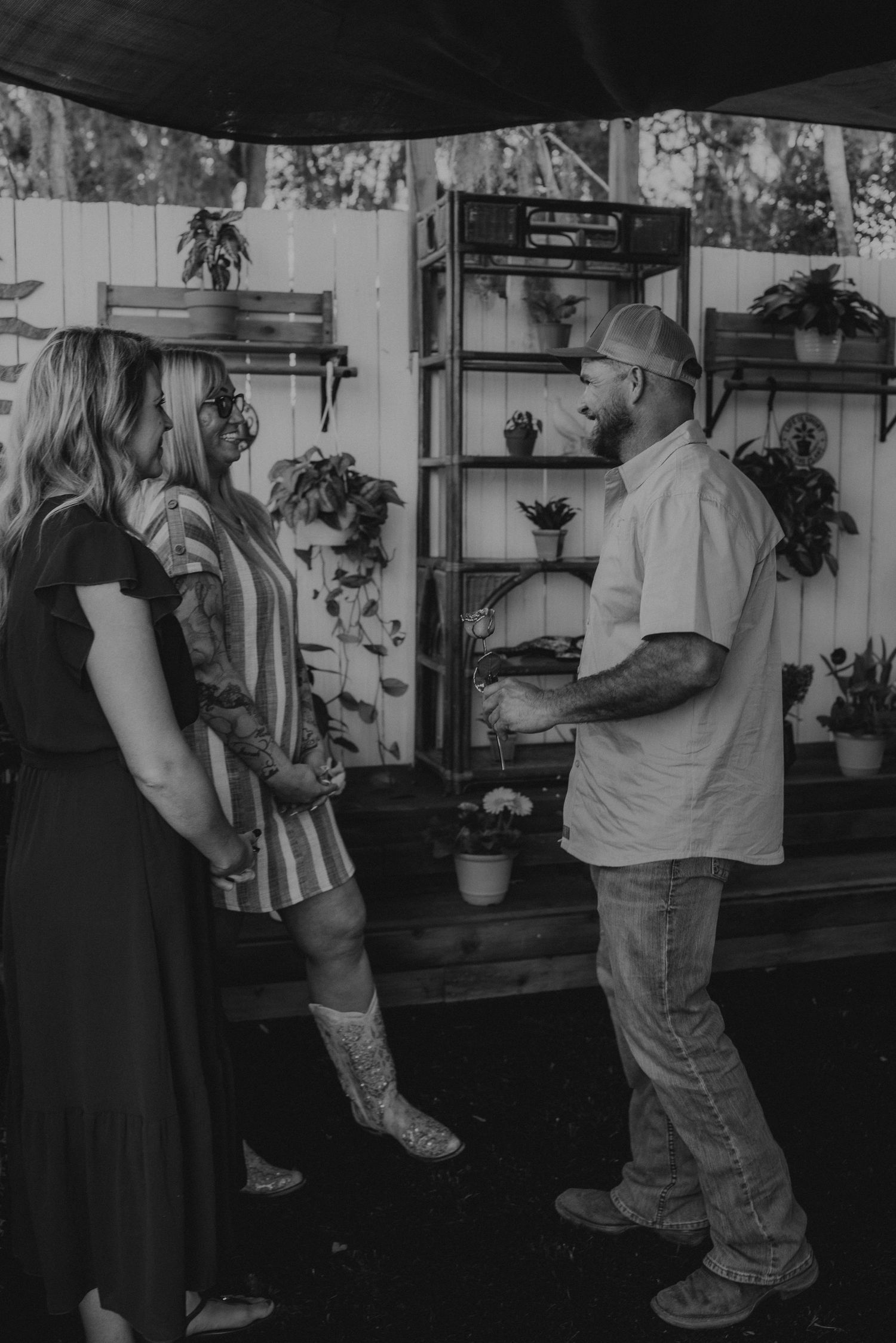 Black and white photo sequence shows two people dancing together in a casual indoor setting.
