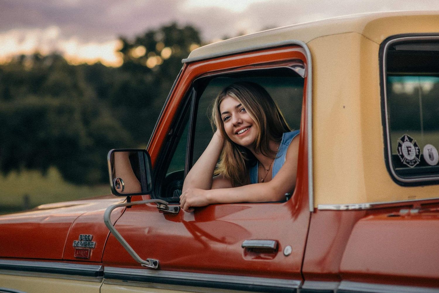 Classic cream and orange vintage trucks photographed during sunset.