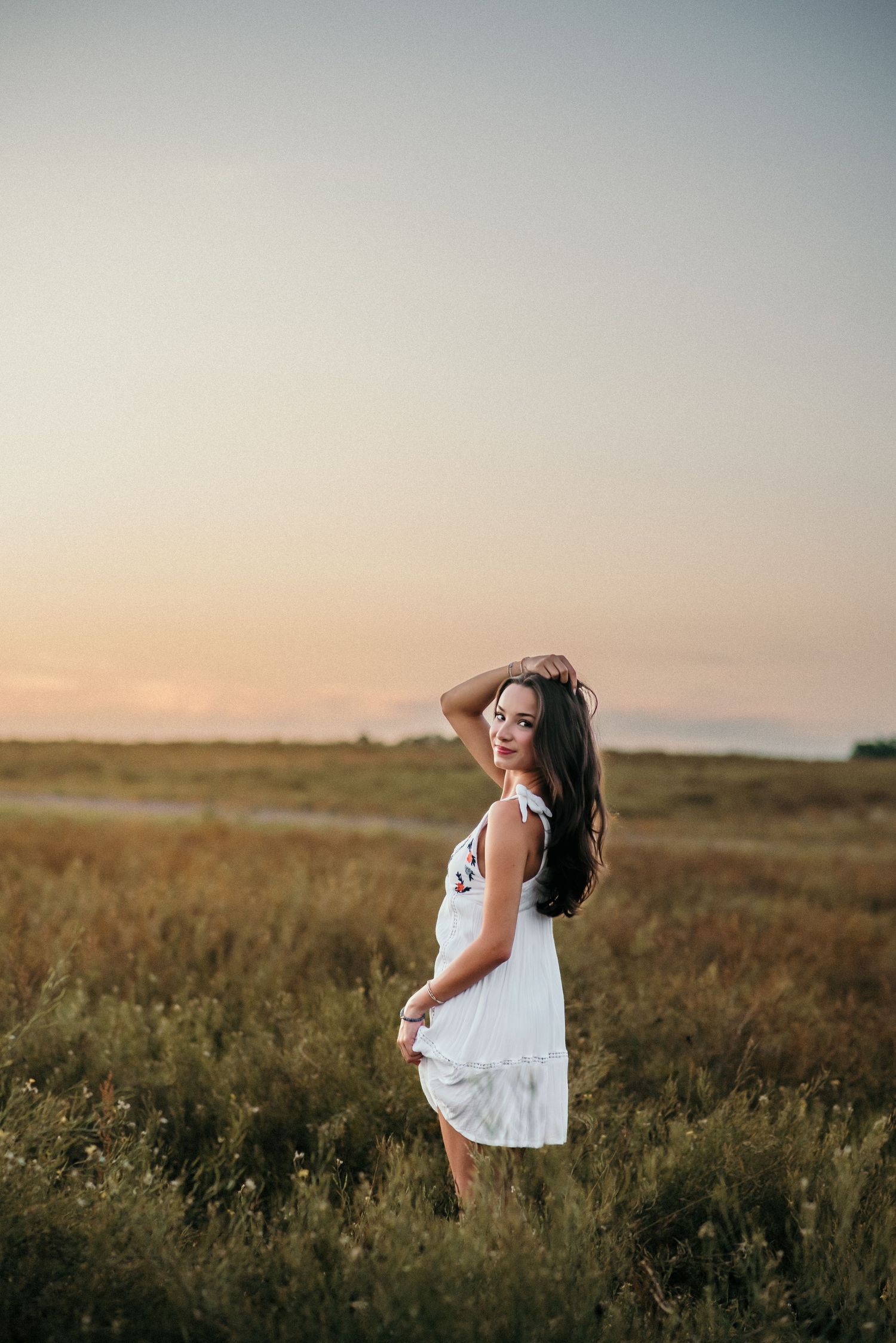 Ethereal summer photography in a natural meadow setting with warm evening light.