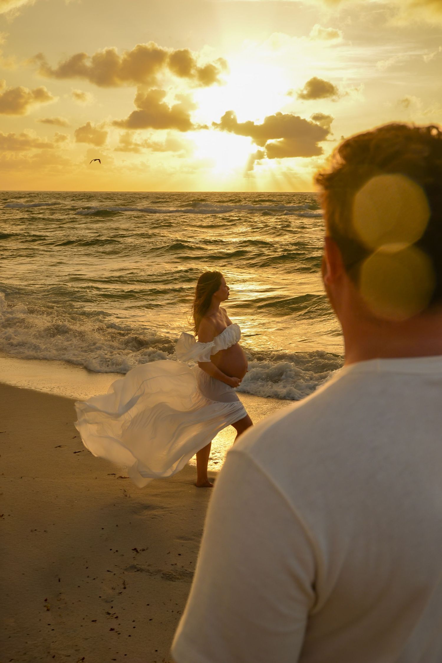 Mother-to-be posing during a sunset maternity session in Miami.
