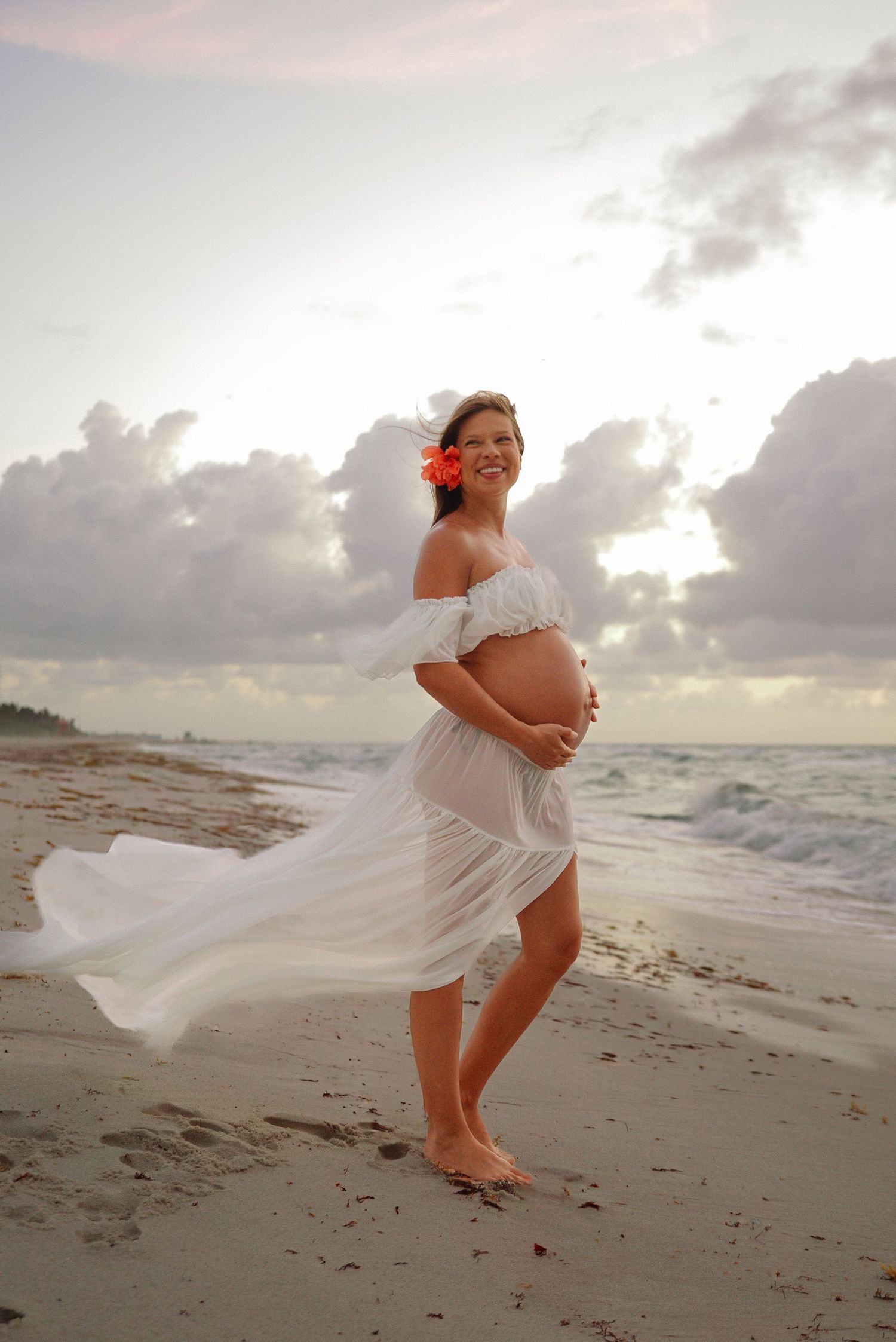Mother-to-be posing during a sunset maternity session in Miami.
