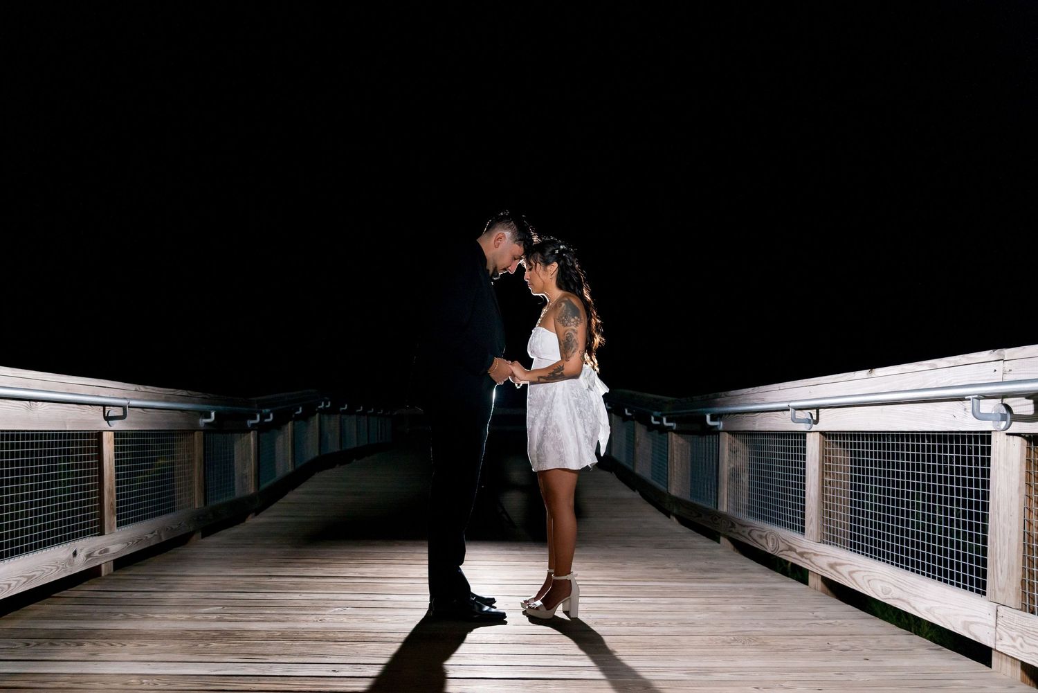 Dramatic wedding moments on bridge