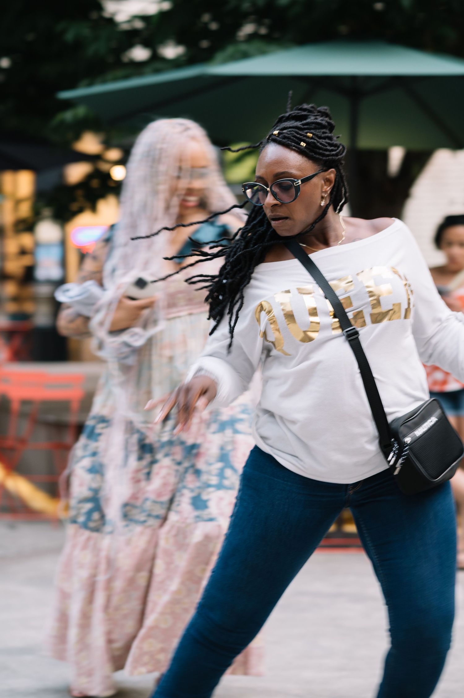Street fashion scene with blurred motion and urban styling.