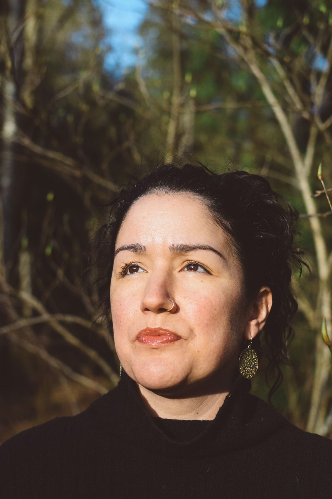 Artistic portrait series showing different angles in natural sunlit forest setting.