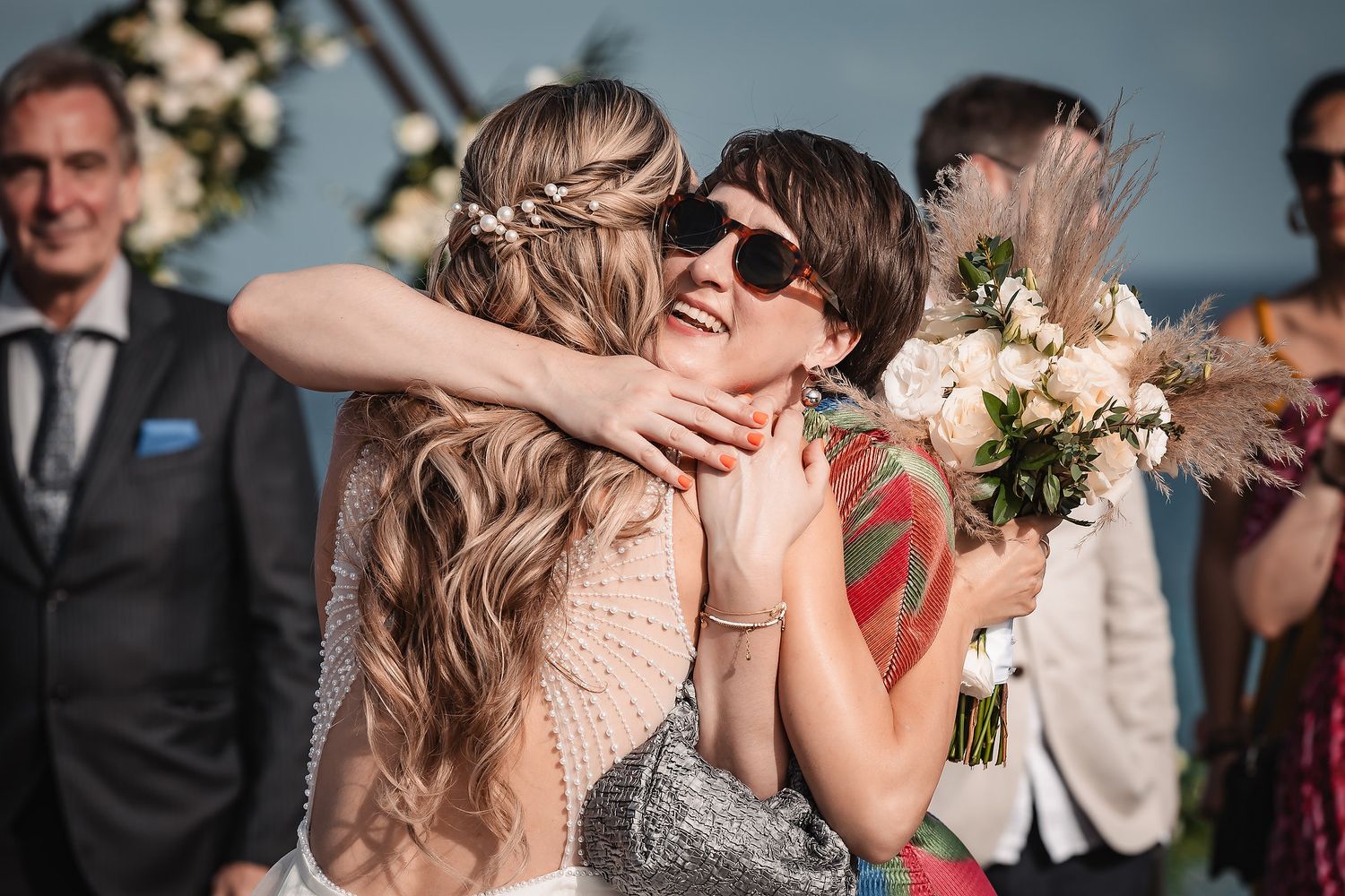 Emotional moments shared between wedding guests during reception celebrations.