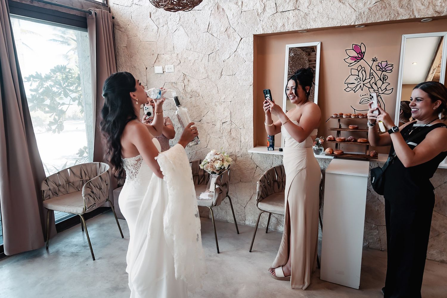Wedding preparation moments captured in a rustic venue with white textured walls.