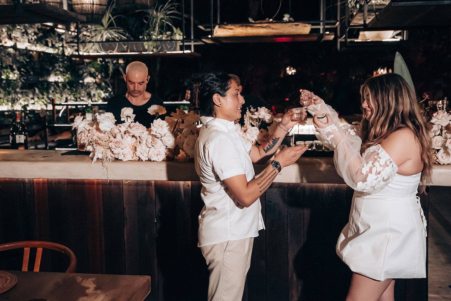 A sequence of wedding reception dance photos showing joyful moments between people in white attire on the dance floor.