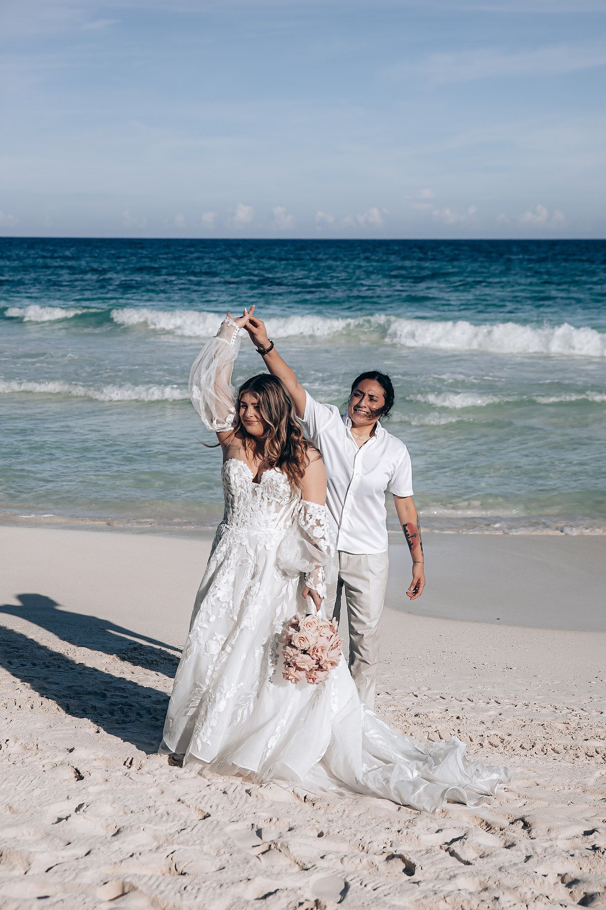 Wedding couple walking on the beach at Nu Tulum Tulum