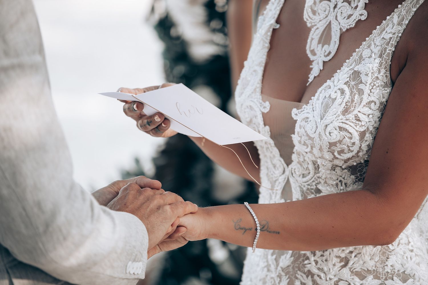 Close-up details of intricate lace wedding dress bodice.